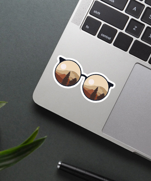 Mockup of Aesthetic Sunglass Sticker on a laptop