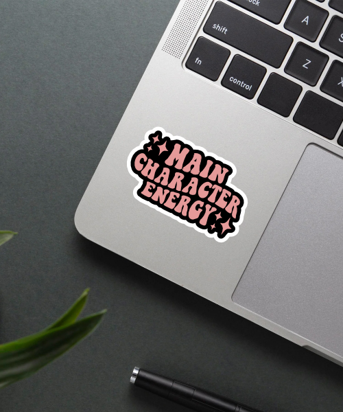 Mockup of Main Character Energy Sticker on a laptop.