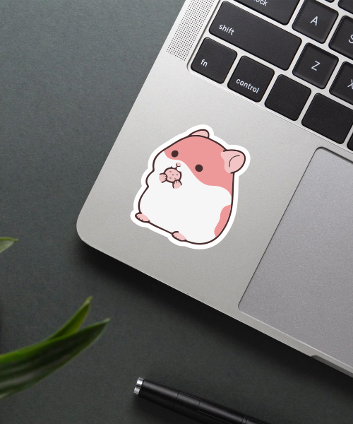 Cute Hamster With Nuts Sticker - Adorable Vinyl Sticker 2 Mockup showing the cute hamster sticker applied on a laptop.