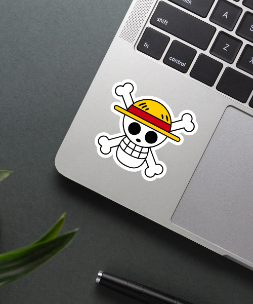 straw hat pirate one piece anime sticker on phone case surface showing bold skull logo and yellow hat