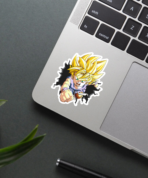 goten super saiyan sticker on laptop surface showing flying punch and bright colors