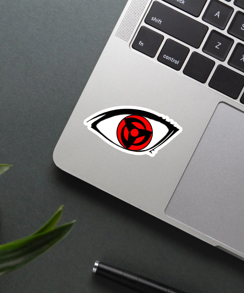 sharingan eye naruto anime sticker on laptop showing bold red and black symbol