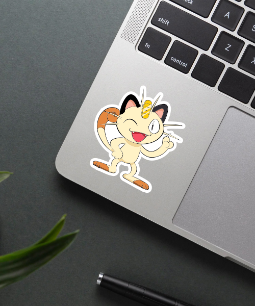 meowth pokemon sticker on laptop surface showing playful pose and bright colors