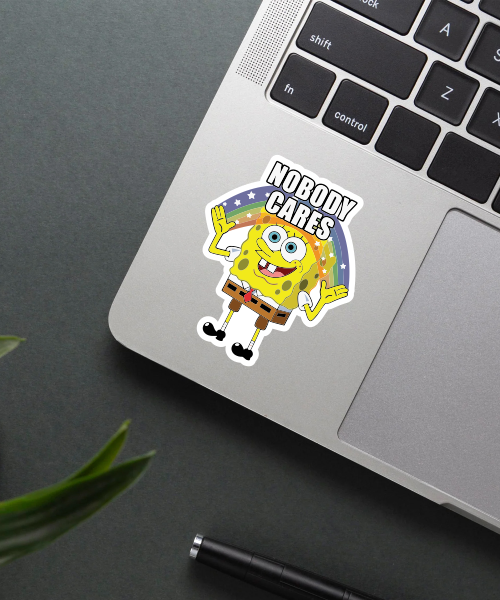 spongebob nobody cares sticker on laptop showing cartoon with rainbow and bold text