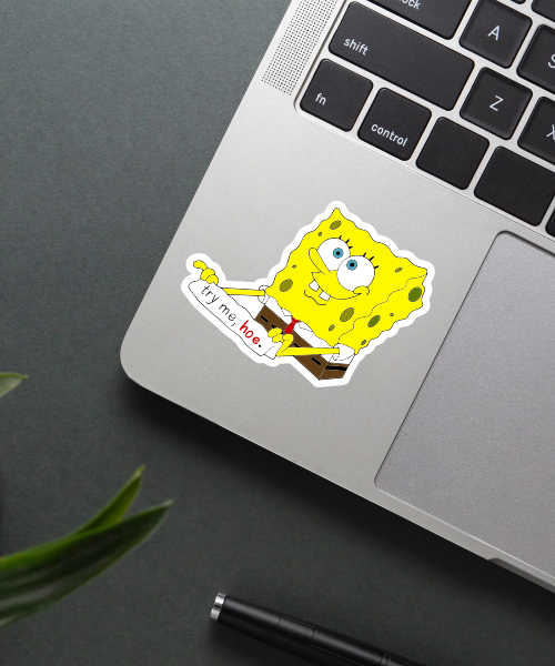spongebob sticker on laptop surface showing bright colors and cheeky text