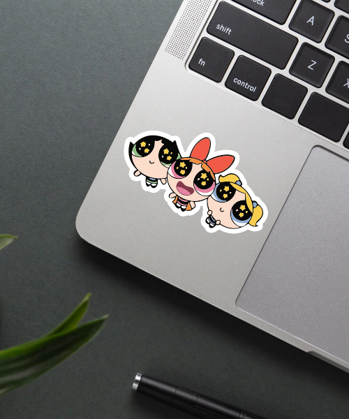 powerpuff girls cartoon sticker on laptop surface showing glittery eyes trio