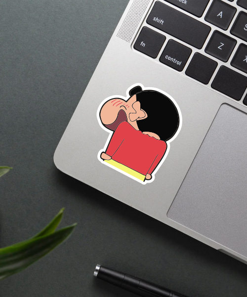 wicked shinchan sticker on laptop surface showing cheeky blush and smile