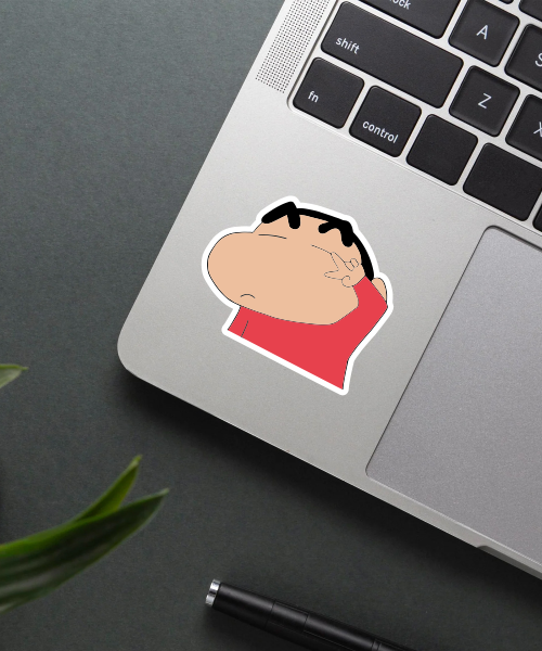 shinchan fooling around sticker on laptop surface showing peace sign and red shirt