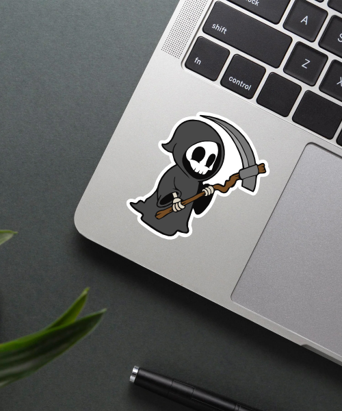 cute death cartoon sticker on skateboard surface showing grim reaper with scythe and black cloak