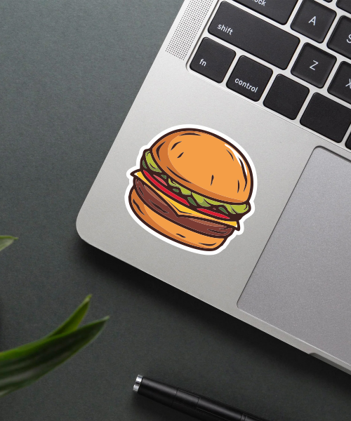 Hamburger sticker on a laptop surface.