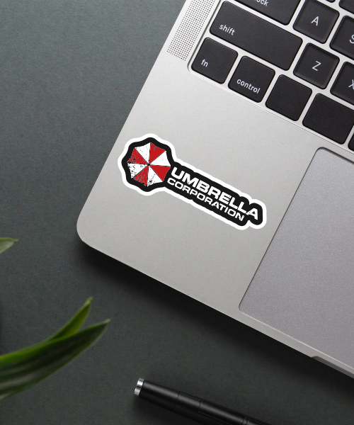 Umbrella Corporation sticker on a laptop surface.