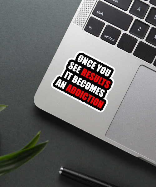 Mockup of Results Become Addiction sticker on a laptop.