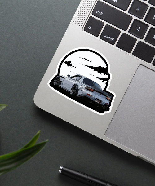 mazda rx7 car sticker on laptop surface showing detailed car and moon design