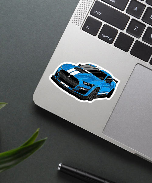 ford mustang shelby gt500 car sticker on laptop surface showing vibrant blue and white colors