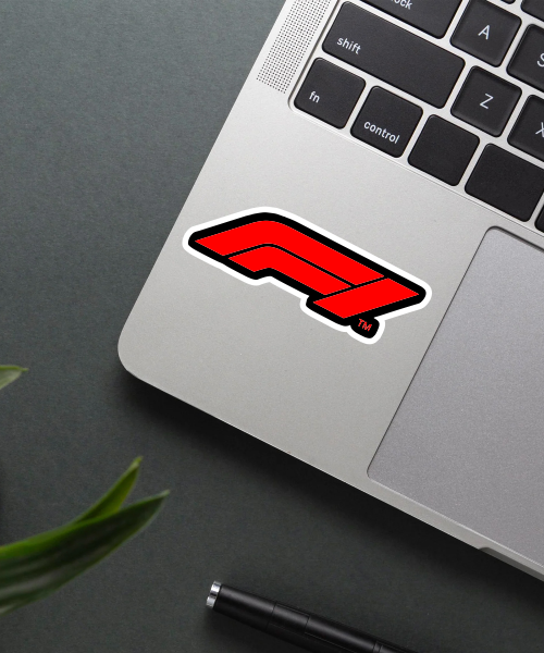 formula1 logo sticker on laptop surface showing bold red black racing design