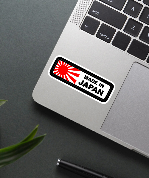 made in japan sticker on helmet surface showing red rising sun and black text