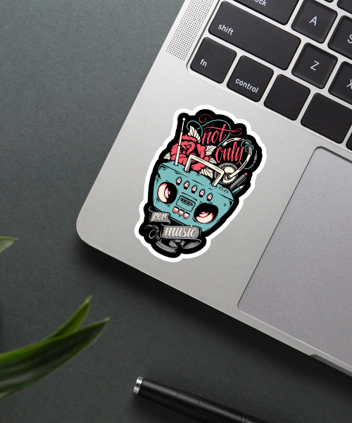 music sticker with retro radio and headphones on laptop surface
