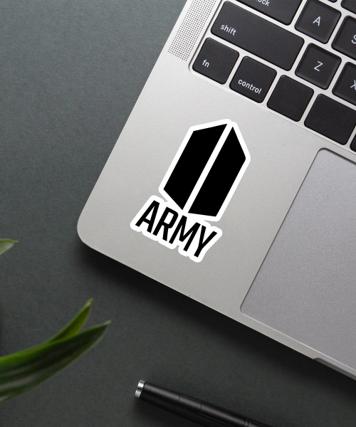 bts army logo sticker on laptop surface showing bold black and white design