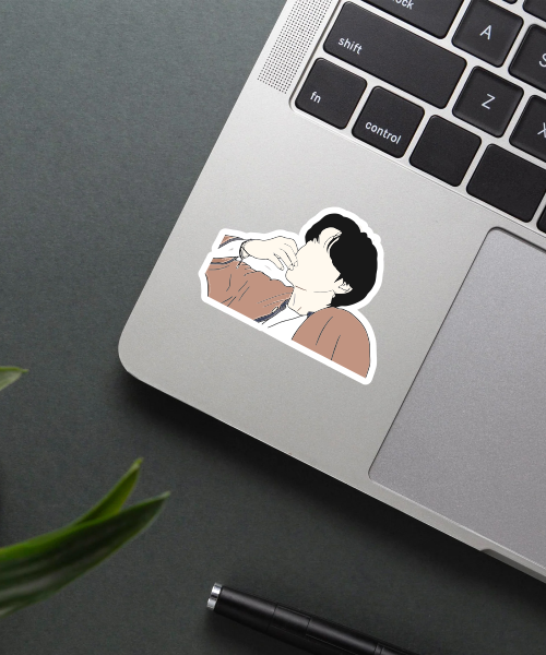 taehyung bts sticker on laptop surface showing casual style with brown jacket
