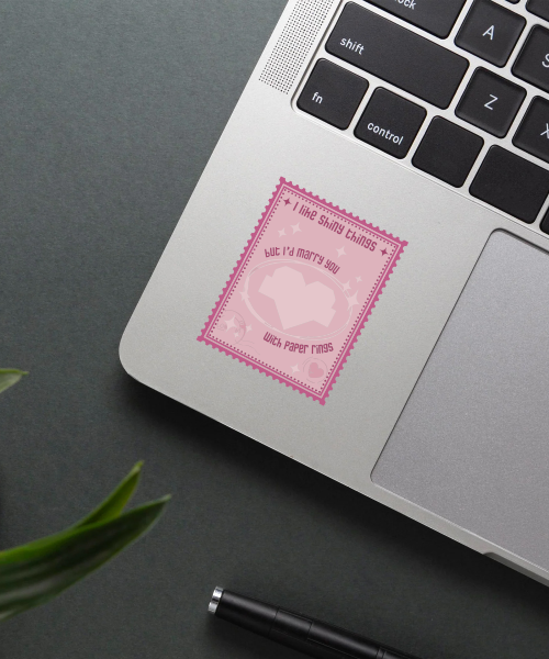 marry you taylor swift sticker on laptop surface showing pink stamp style and pixel heart