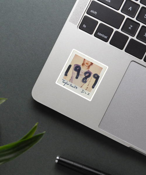 taylor swift vinyl sticker on laptop surface showing 1989 album cover