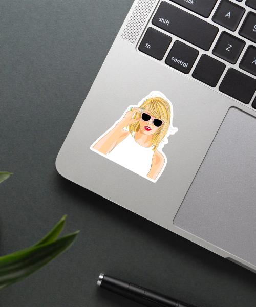 shes taylor vinyl sticker on laptop surface showing illustrated cool style