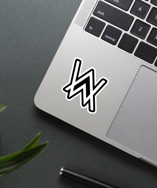 Alan Walker music sticker on a laptop showing the bold black and white logo
