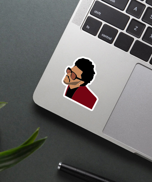 the weeknd blinding lights sticker on phone surface showing side profile and shades