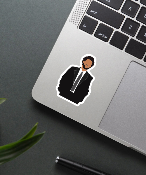 the weeknd suit sticker on laptop surface showing minimalist black suit design