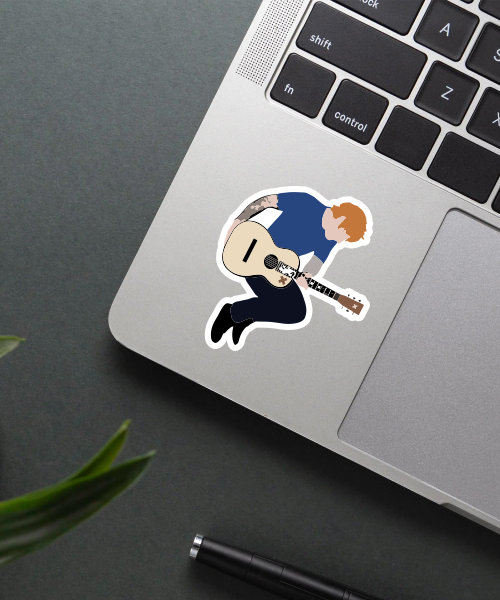 ed sheeran sticker playing guitar in blue shirt on laptop surface