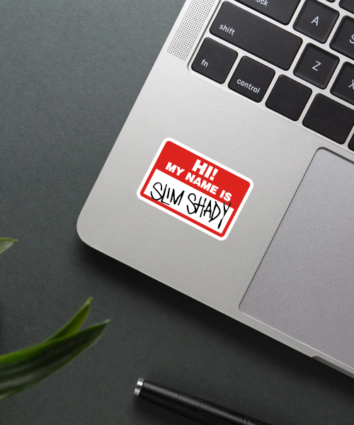 slim shady music sticker on laptop surface showing bold red and white name tag style