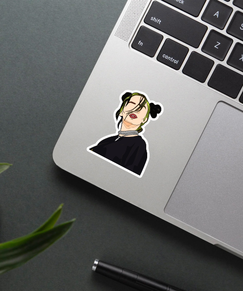 billie eilish concert sticker on laptop surface showing green hair and black outfit