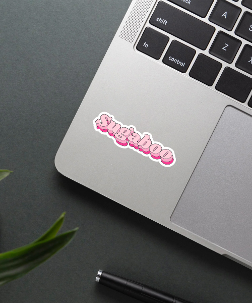 sugaboo vinyl sticker on laptop surface showing pink 3D style letters