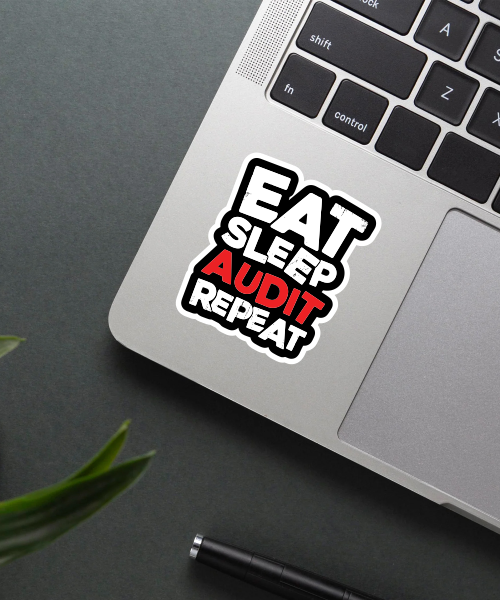 eat sleep audit repeat sticker on laptop surface showing bold red and white text