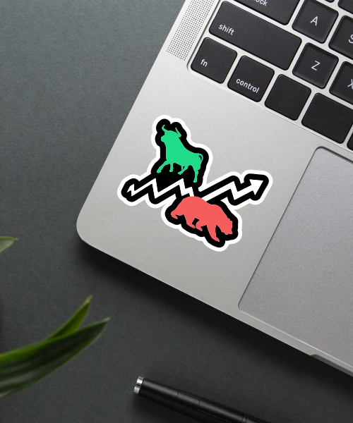 stock market sticker on laptop surface showing bull and bear with trend arrows