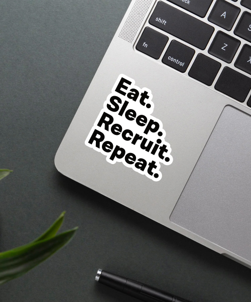 eat sleep recruit repeat sticker on laptop surface showing bold black text
