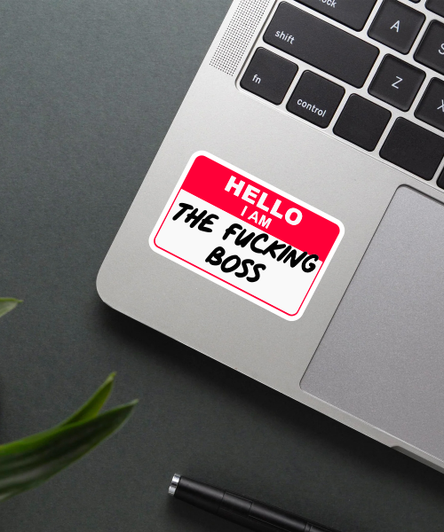 hello i am the boss sticker on laptop surface showing red white name tag style