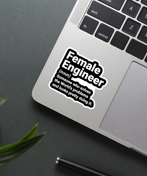 Female Engineer definition vinyl sticker placed on a laptop surface with black and white text.
