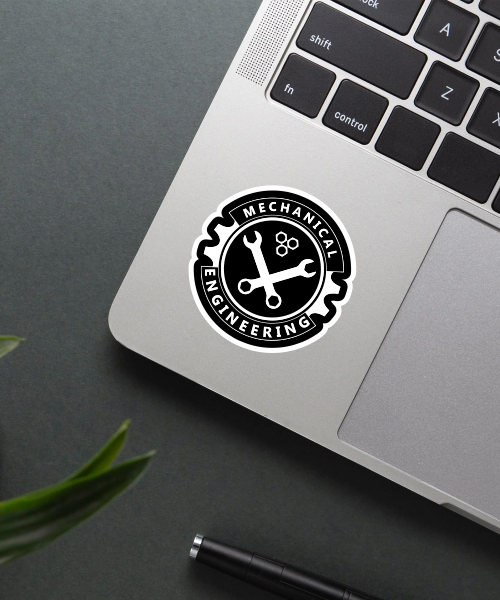 mechanical engineering sticker emblem on laptop surface showing black white gear wrench design