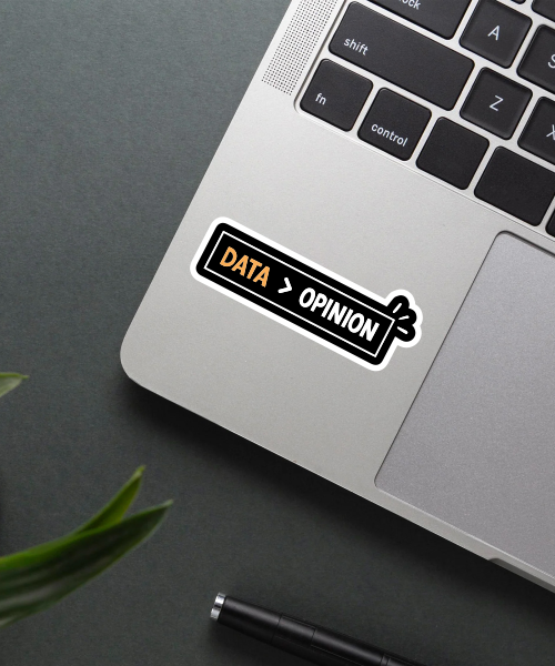 data science sticker on laptop surface with black background and orange highlight