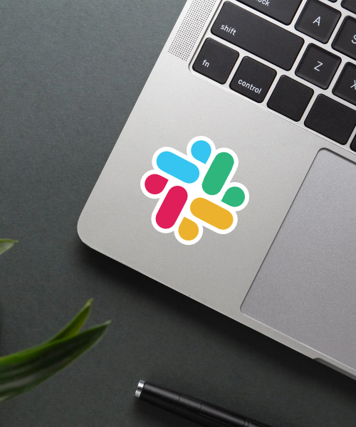Slack sticker applied on a laptop surface.
