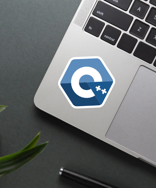 Mockup of C++ sticker applied on a laptop.
