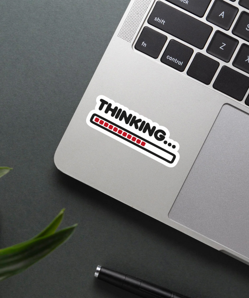 thinking sticker on laptop surface showing red loading bar and black text