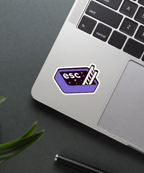 ESC key vinyl sticker with purple escape button applied on laptop surface showing vibrant colors and neat edges