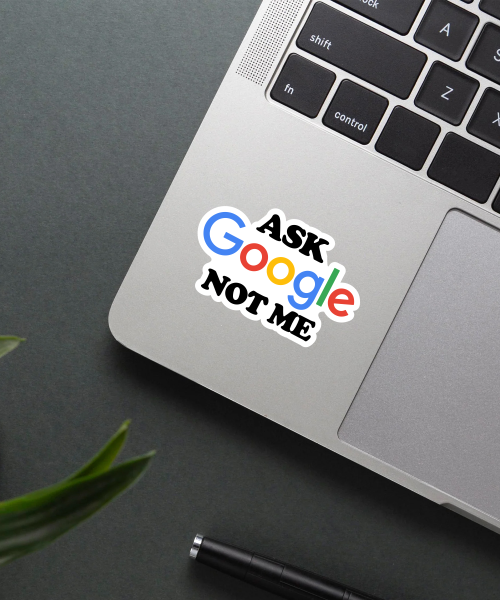 ask google not me sticker on laptop surface showing bold black text and colorful google logo