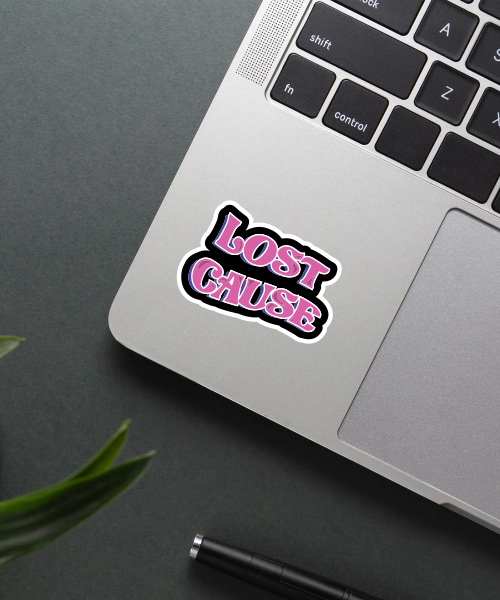 lost cause sticker on laptop surface showing bold pink and black text