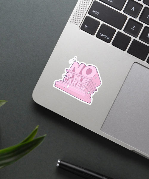 no one cares vinyl sticker on laptop surface showing pink statue and 3d text