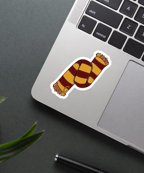gryffindor scarf sticker on laptop surface showing red yellow stripes and 'G' initial