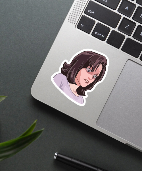monica geller sticker on laptop surface showing expressive face and dark hair