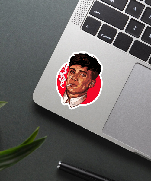 thomas shelby sticker on laptop surface showing vibrant colors and clear details